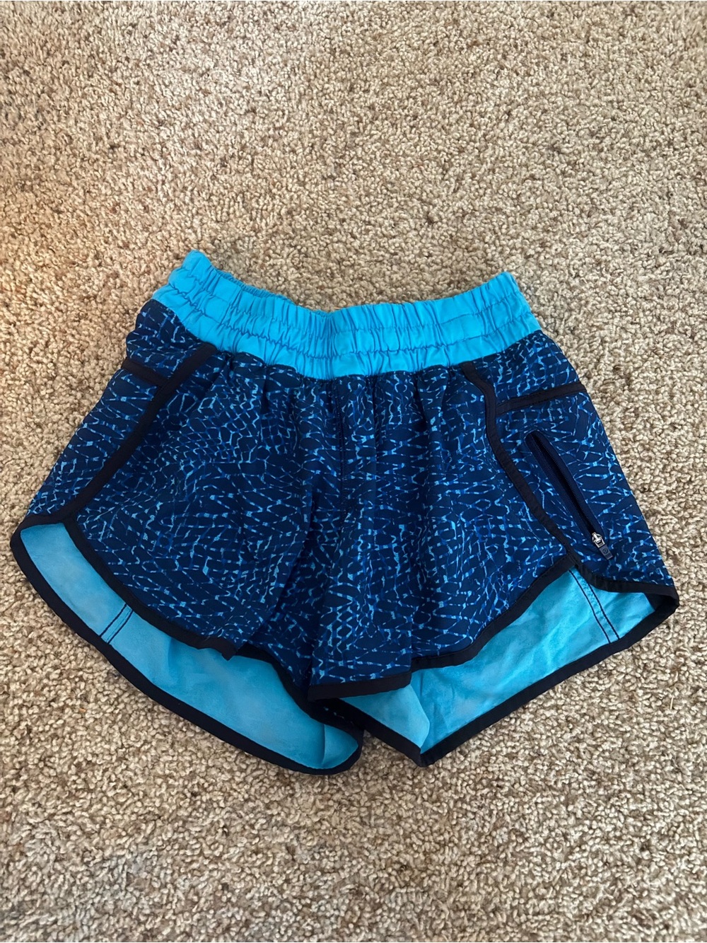 lululemon blue patterned athletic shorts with aqua waistband